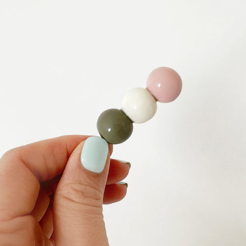 Odango utensil rest being held by a woman's hand
