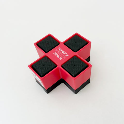 Plastic cube food mold.